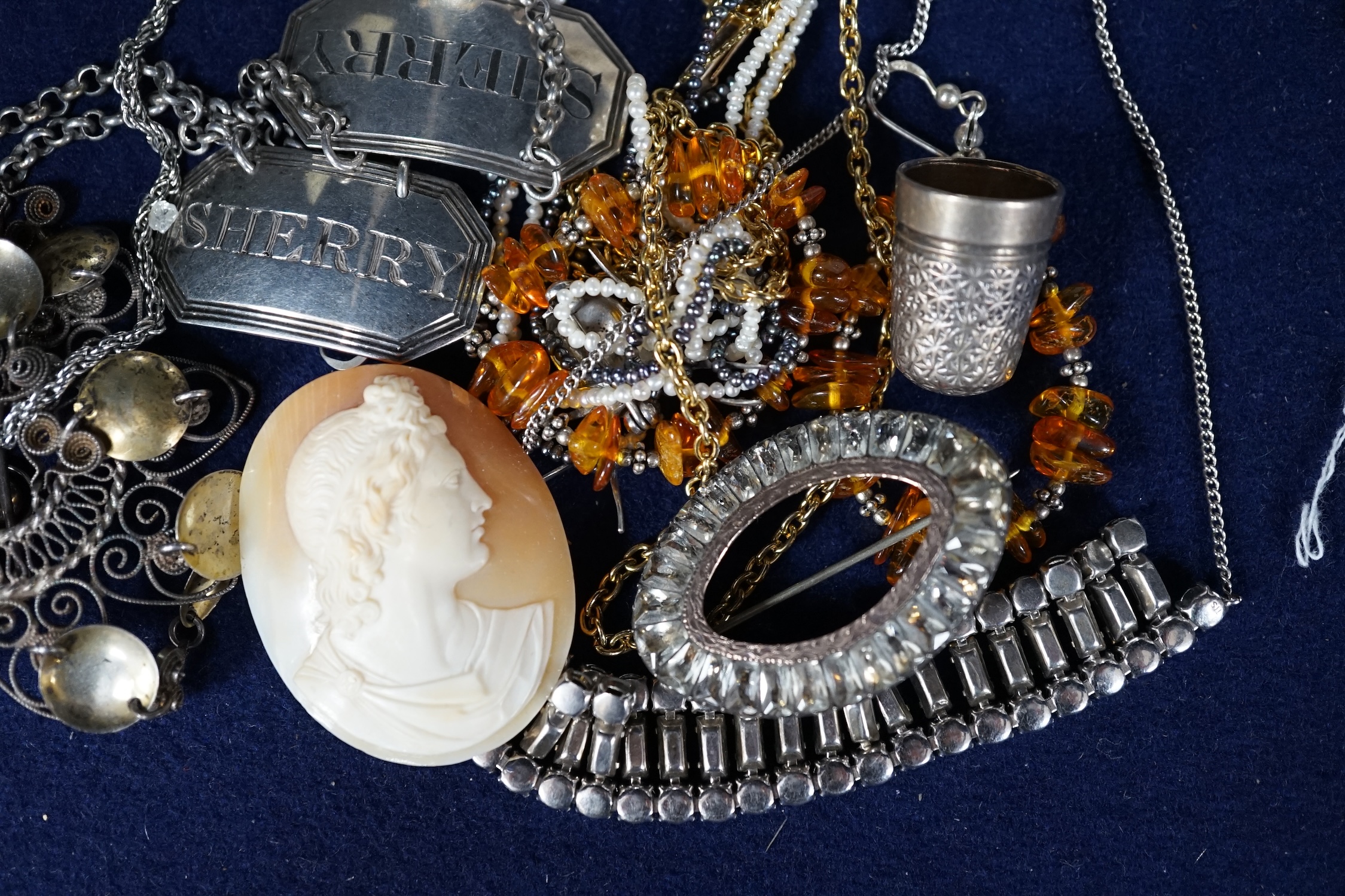 A small collection of assorted costume jewellery and other items including a paste set fringe necklace and brooch and two Georgian silver wine labels, London, 1818 and London 1828. Condition - poor to fair